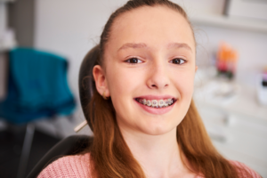 a child smiling at their orthodontist