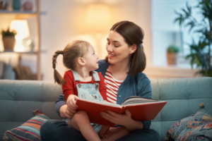 a mother and child reading together